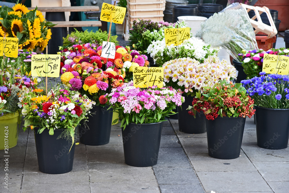 A lot mixed kind and colorful of flower for sale in on street at Munich germany with German name of flower.