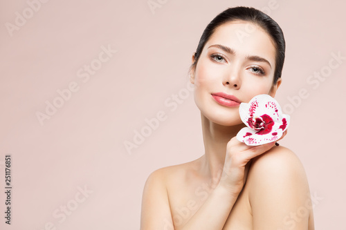 Woman Natural Beauty Makeup Portrait with Orchid Flower, Beautiful Girl Skin Care and Treatment
