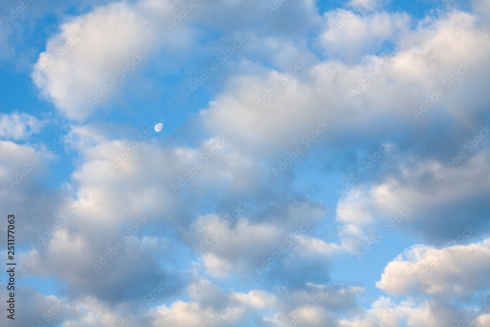 Blue summer sky white cumulus clouds and moon Blue summer sky white cumulus clouds and moon