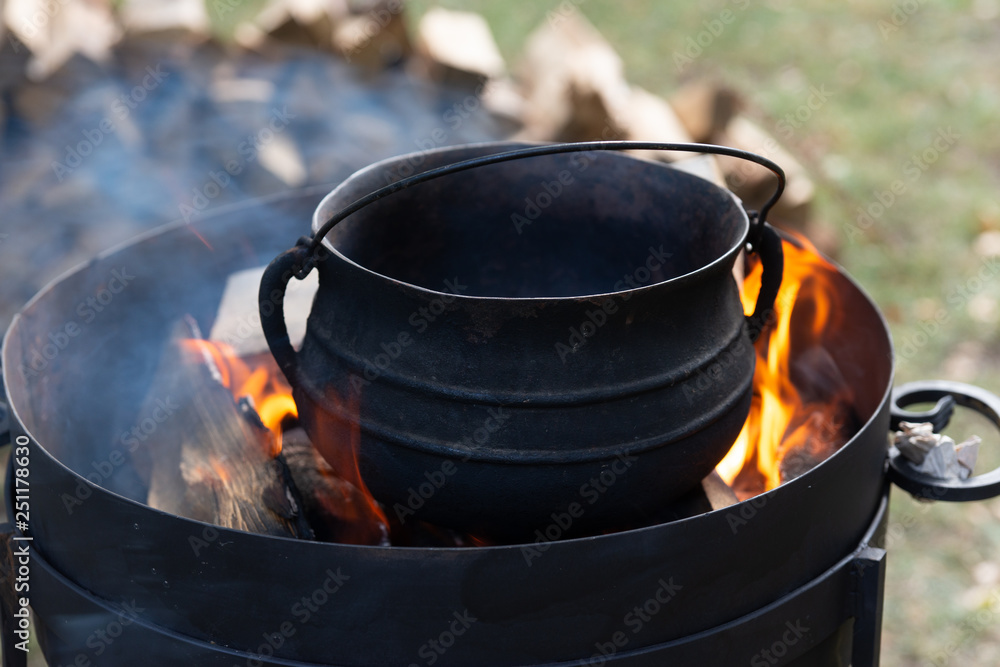 Preparation of food on an open fire Preparation of food on an open fire