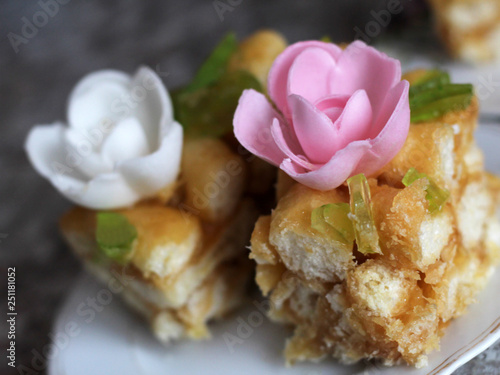 national dish chuck chuck with pink and white cream flowers photo