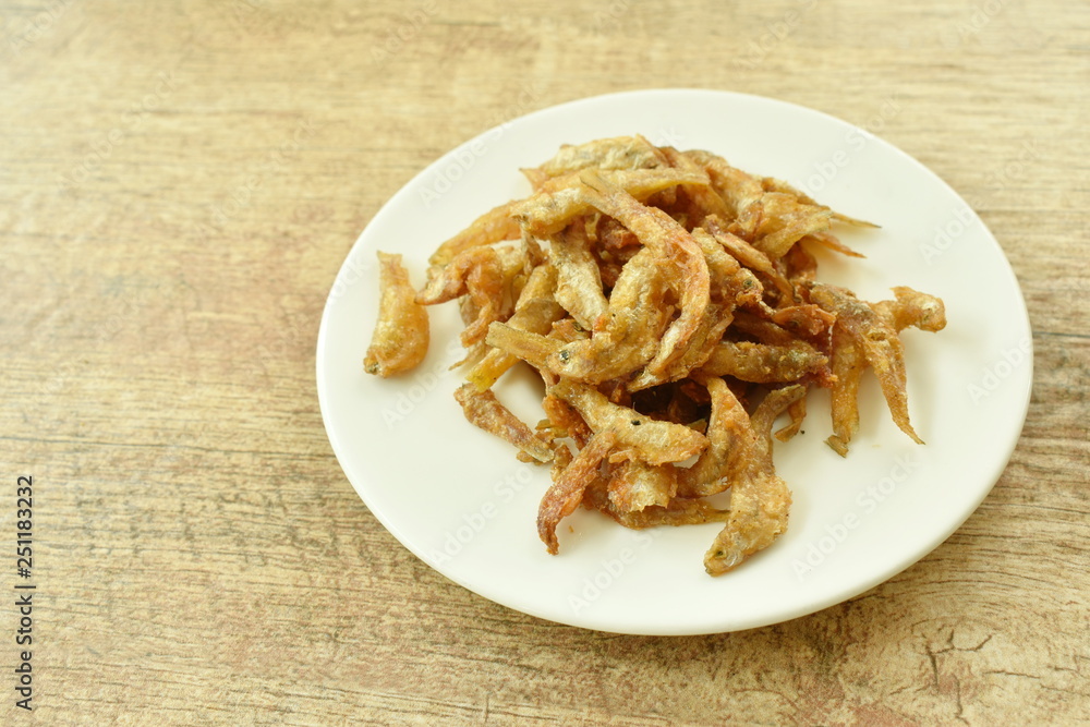 crispy fried anchovy fish with salt on plate crispy fried anchovy fish with salt on plate