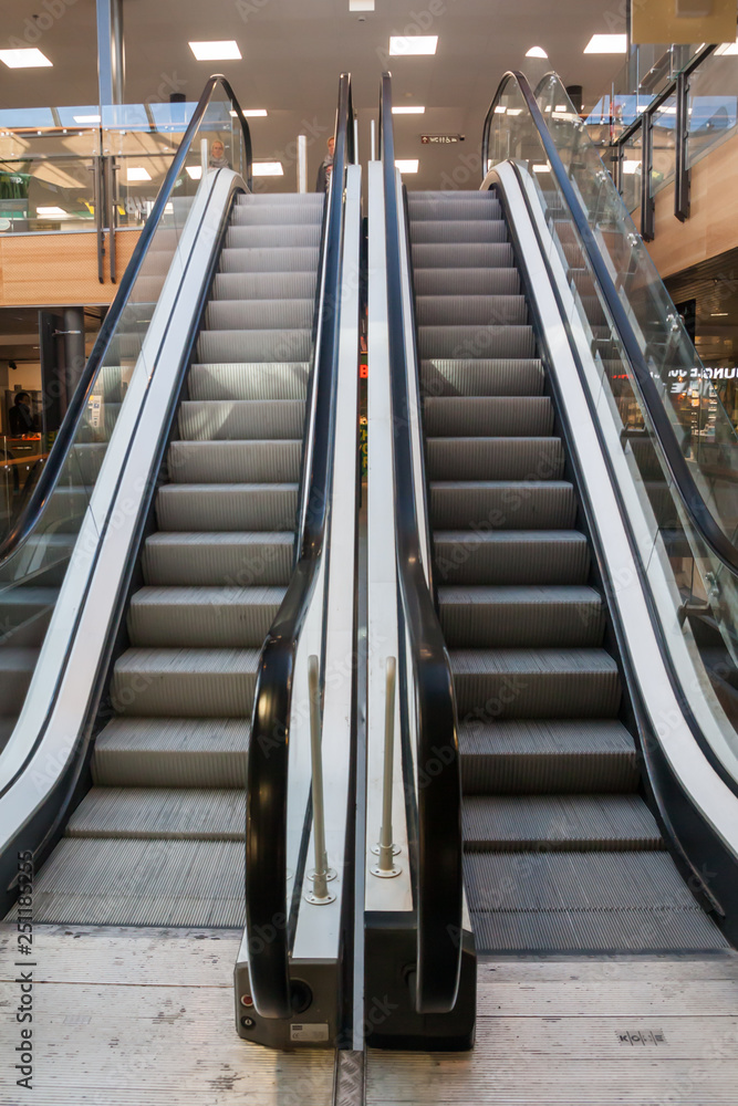 KOTKA, FINLAND - SEPTEMBER 27, 2018: Escalator in the Shopping Center Pasaati. Town is located in The Kymenlaakso Region of Finland. KOTKA, FINLAND - SEPTEMBER 27, 2018: Escalator in the Shopping Center Pasaati. Town is located in The Kymenlaakso Region of Finland.