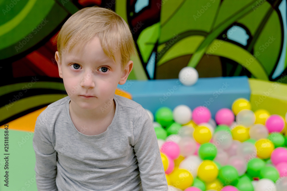 Four year old boy playing at new playground kindergarten. Four y Four year old boy playing at new playground kindergarten. Four y