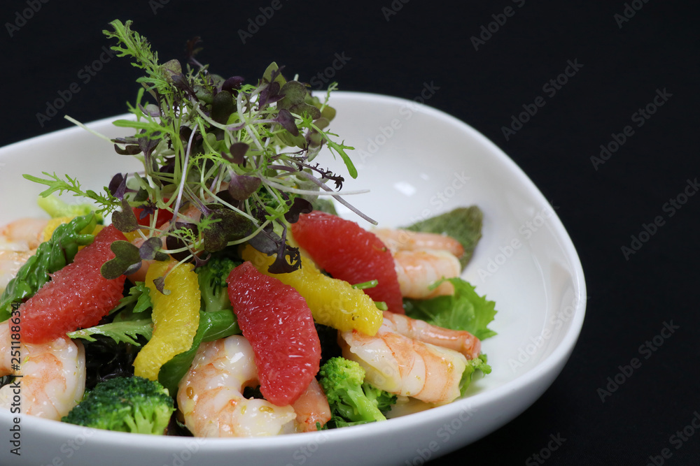 prawns and citrus frfuits salad in a serving bowl prawns and citrus frfuits salad in a serving bowl