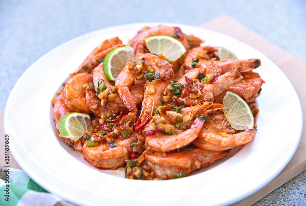Shrimps fried with chilies and salt with slice lime. Shrimps fried with chilies and salt with slice lime.