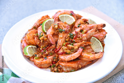 Shrimps fried with chilies and salt with slice lime.