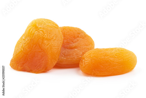 Heap of dried apricots, close-up, isolated on white background