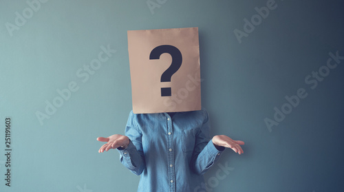 Woman has Confused, Thinking, Question Mark Icon on Paper Bag, copy space.
