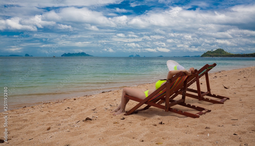 Thailand. Woman sea, bikini, hat, tan, sunbed. Libong Thailand. Woman sea, bikini, hat, tan, sunbed. Libong