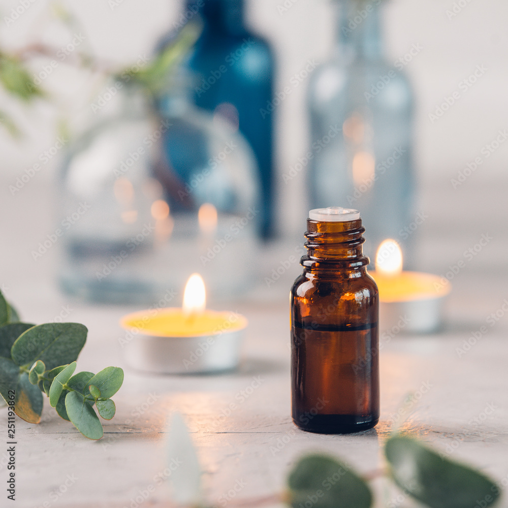 Eucalyptus essential oil and fresh leaves on the stone board. Eucalyptus essential oil and fresh leaves on the stone board.