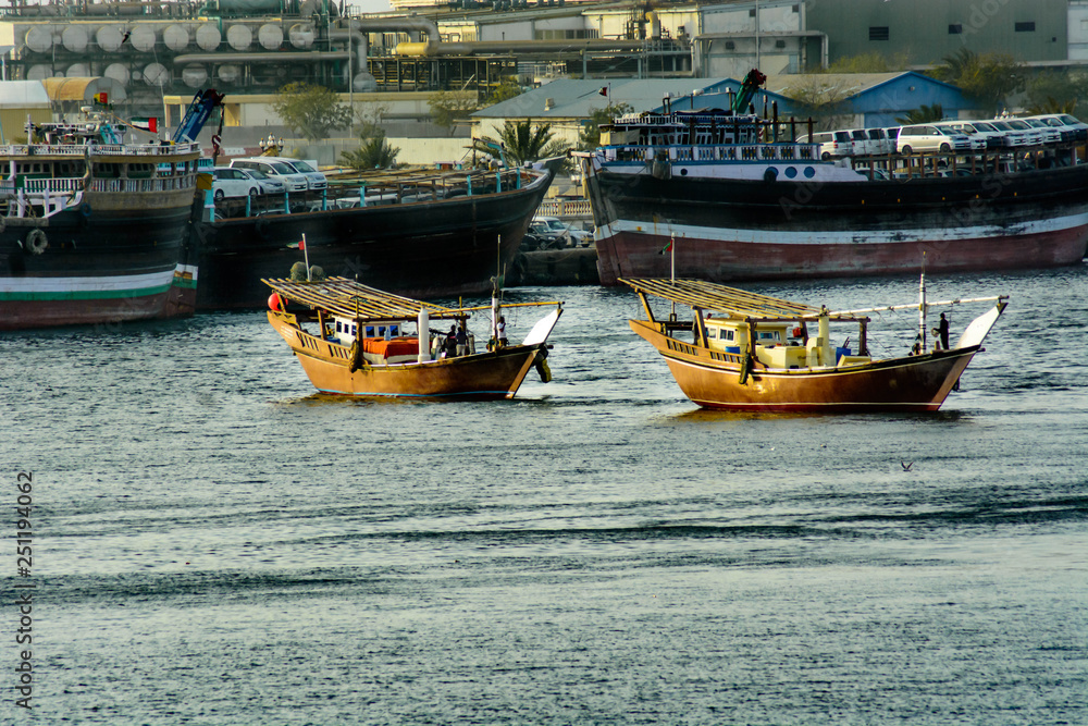 Obraz premium Fisherman sailing in fishing boat on water