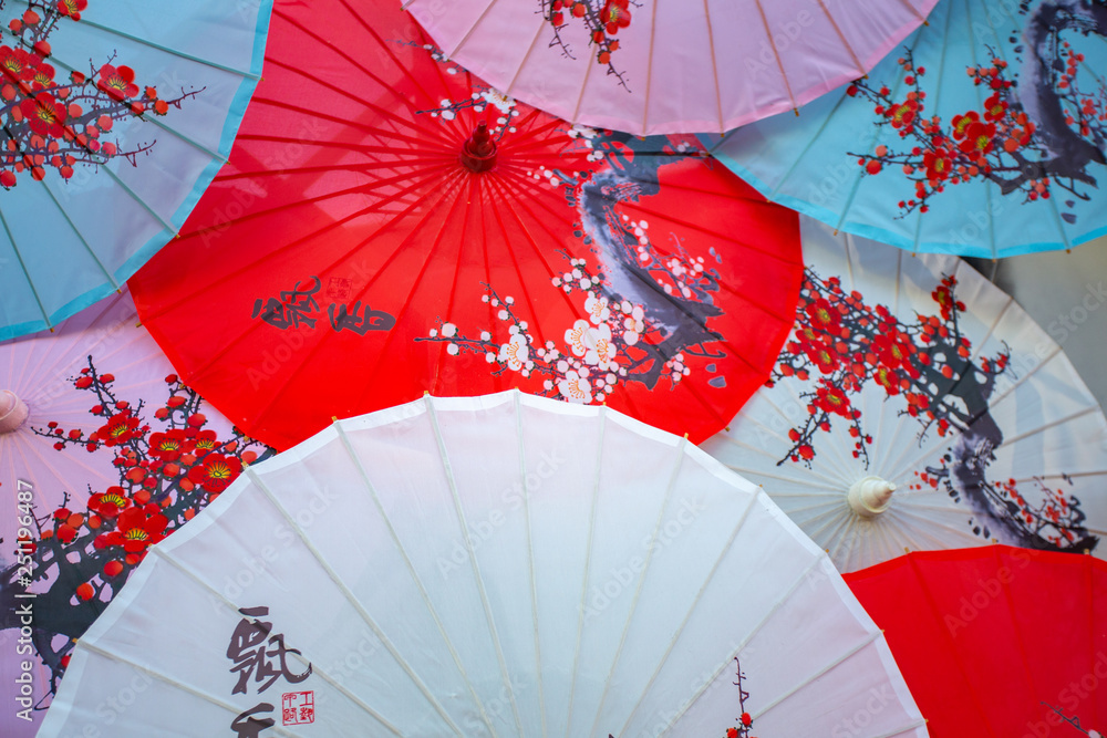 Ancient Japanese umbrellas placed in multicolored patterns,Old wooden