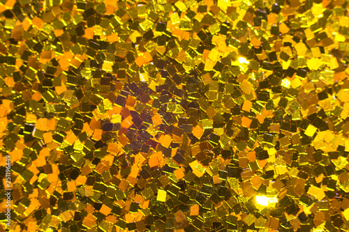 Gold glitter texture. Festive sparkling sequins background. Wpaper for Valentine, New Year or Christmas Holidays. photo