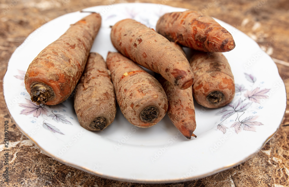 Boiled carrots in a plate on the table Boiled carrots in a plate on the table