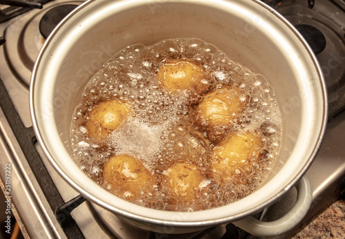 Potatoes are cooked in a pan in the kitchen