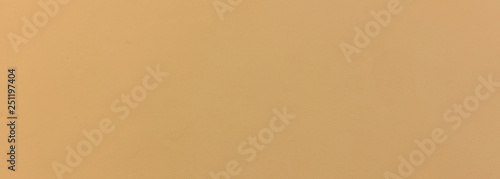 Stucco painted wall texture background, yellow, color, banner