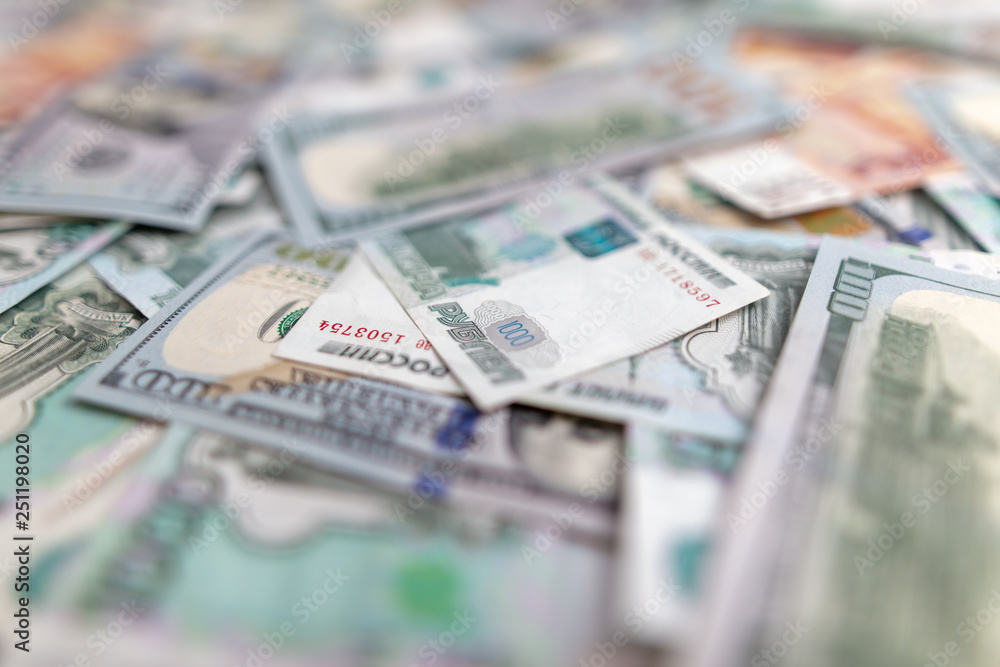 Dollars and Russian rubles on the table as background
