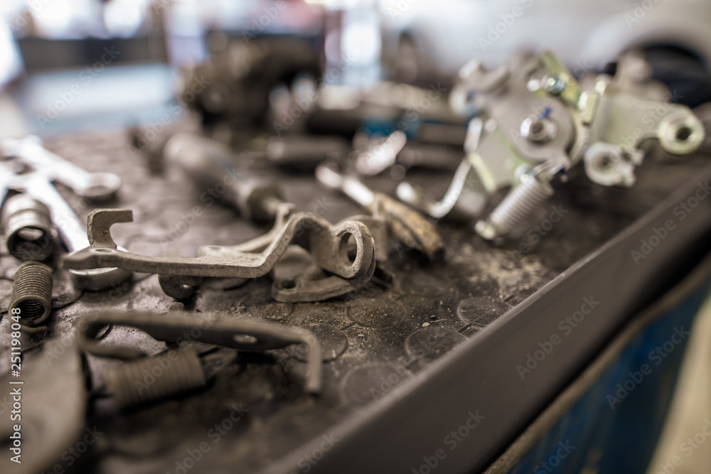 Bolts from the car in the workshop Bolts from the car in the workshop