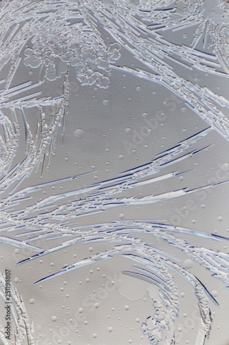 Snow patterns on glass as an abstract background