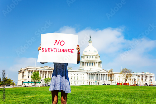 Protester holding in hands sign no surveillance