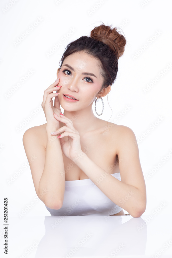 Portrait of attractive asian woman sitting smiling on white background. Healthy skin woman natural makeup beauty face concept. Using as your Product. Portrait of attractive asian woman sitting smiling on white background. Healthy skin woman natural makeup beauty face concept. Using as your Product.