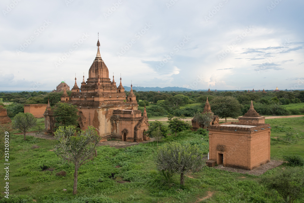view of pagoda on bagan field in myanmar by sunset
