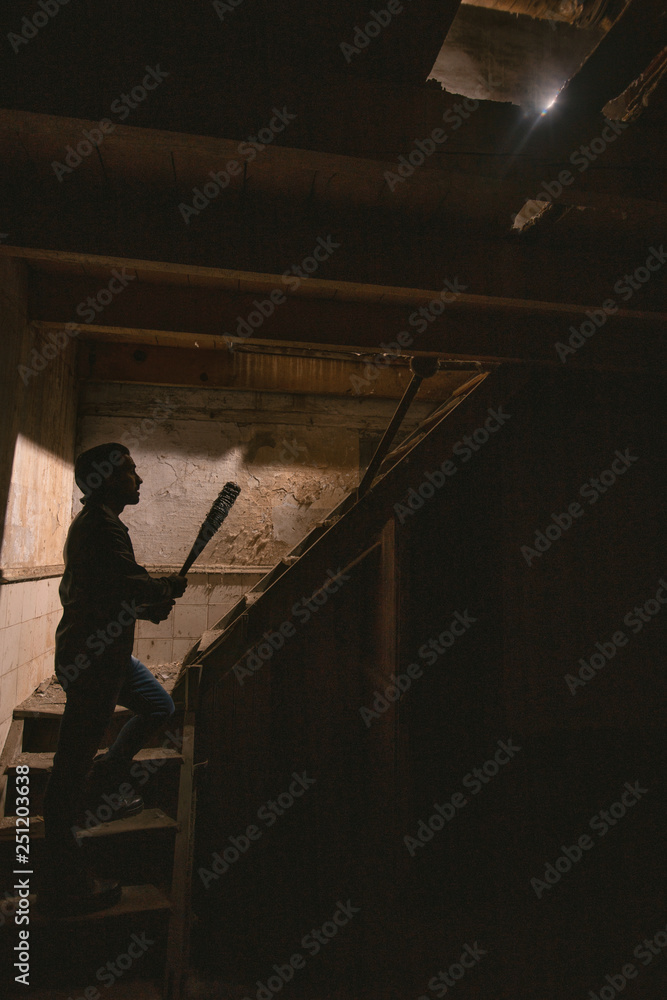 Fototapeta premium man in leather jacket and baseball bat