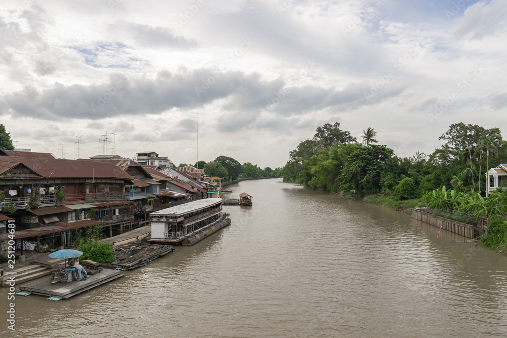 Samut Songkhram, Thailand - July 15, 2018 : Amphawa floating market in Samut Songkhram, Thailand. It is one of the most popular floating markets in Thailand. Boat on the river. Samut Songkhram, Thailand - July 15, 2018 : Amphawa floating market in Samut Songkhram, Thailand. It is one of the most popular floating markets in Thailand. Boat on the river.