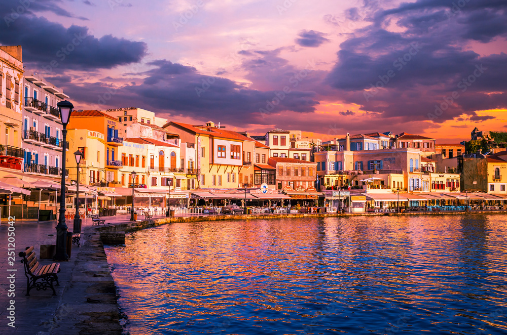 CHANIA, CRETE ISLAND, GREECE - JUNE 26, 2016: Stunning sunset view of the old venetian port of Chania on Crete island, Greece.