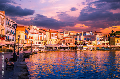CHANIA, CRETE ISLAND, GREECE - JUNE 26, 2016: Stunning sunset view of the old venetian port of Chania on Crete island, Greece. © Lucian Bolca