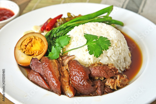 Stewed pork leg with rice and vegetable (Thai name is Khao Kha Moo)