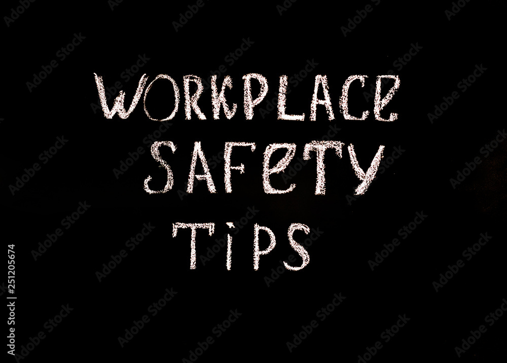 Black background with the inscription workplace safety tips . Safety concept.