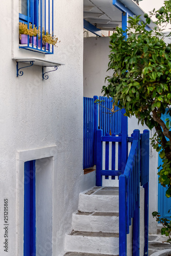 The typical cyclades style with colorful flowers in Parikia town on Paros island, Greece