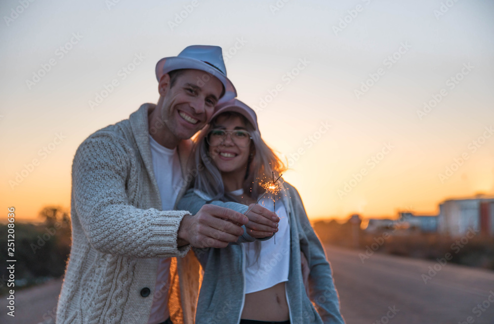 happy couple in sunset with flares