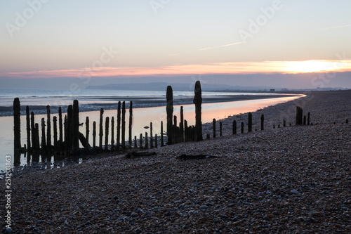 Sunset on the groynes at Rye Harbour