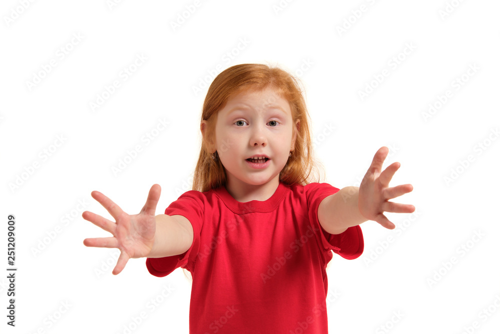 Portrait of cute redhead emotional little girl isolated on a white, trying to reach forward Portrait of cute redhead emotional little girl isolated on a white, trying to reach forward