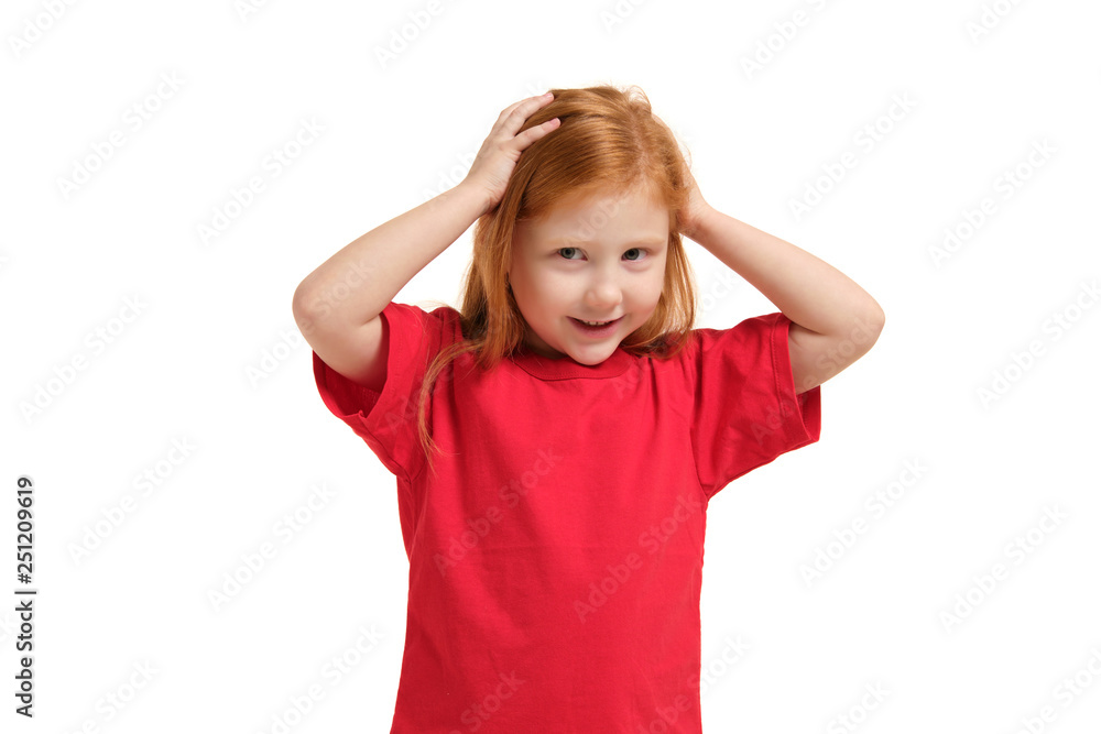 Portrait of cute redhead emotional little girl isolated on a white Portrait of cute redhead emotional little girl isolated on a white