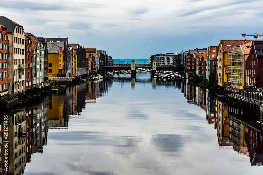 Panoramic view from bridge to famous wooden colored houses in Trondheim city, Norway