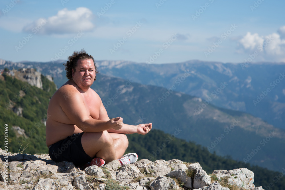 Summer and sport. Funny fat man and yoga. 