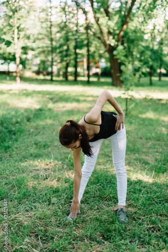 Girl athlete on the nature of yoga
