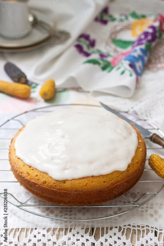 Traditional Romanian or Moldovan corn pie malay, with icing on a light background. Rustic style. Traditional Romanian or Moldovan corn pie malay, with icing on a light background. Rustic style.
