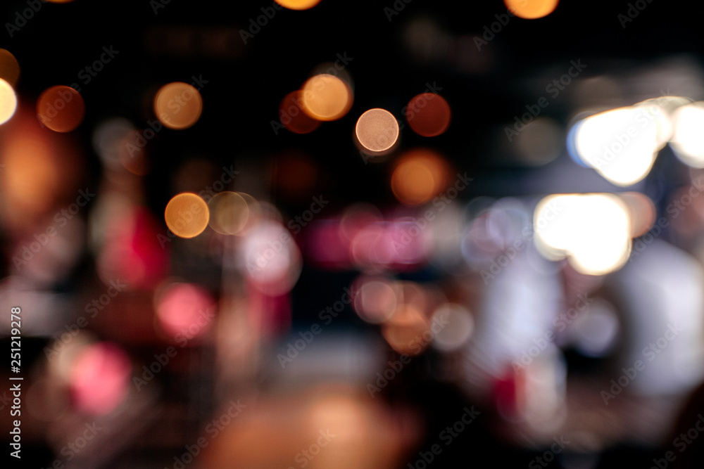 Blurred restaurant or cafe background. Tables and chairs in the lobby of the mall. Visitors to the restaurant for dinner. Beautiful bright interior. Blurred restaurant or cafe background. Tables and chairs in the lobby of the mall. Visitors to the restaurant for dinner. Beautiful bright interior.