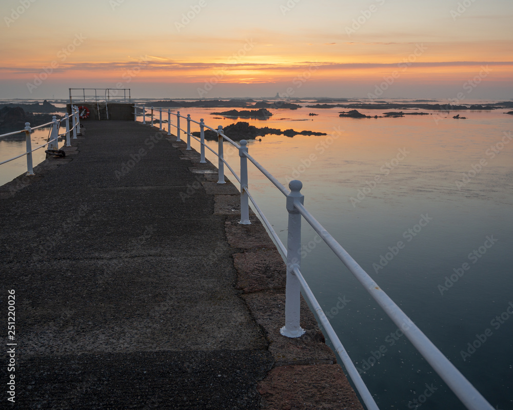 Sunrise Over La Rocque Pier Jersey Channel Islands