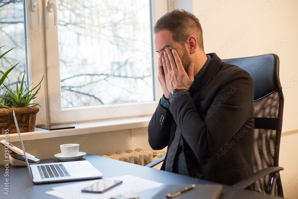 businessman working on laptop in office eyes hurt businessman working on laptop in office eyes hurt
