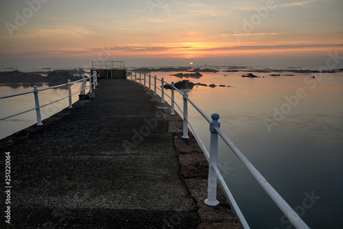 Sunrise Over La Rocque Pier Jersey Channel Islands photo