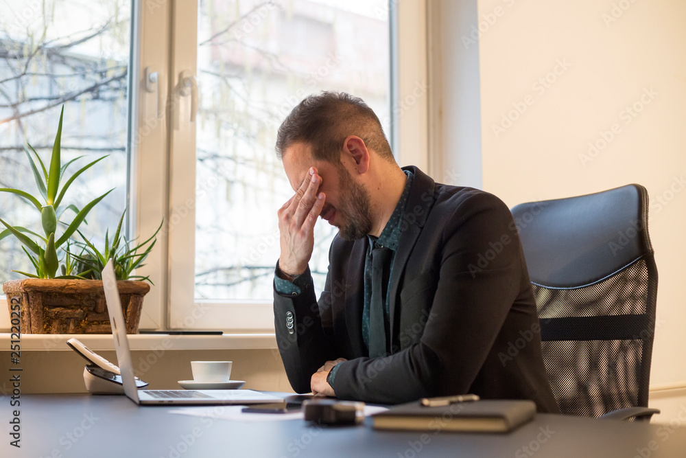 businessman working on laptop in office eyes hurt businessman working on laptop in office eyes hurt