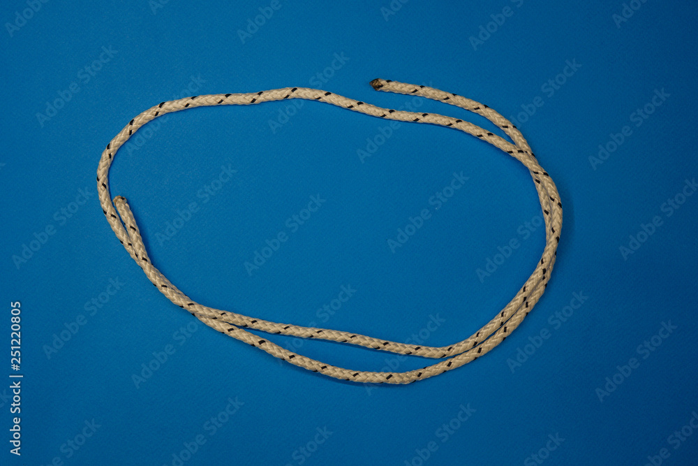 Fototapeta premium Rope breaking isolated over a blue background