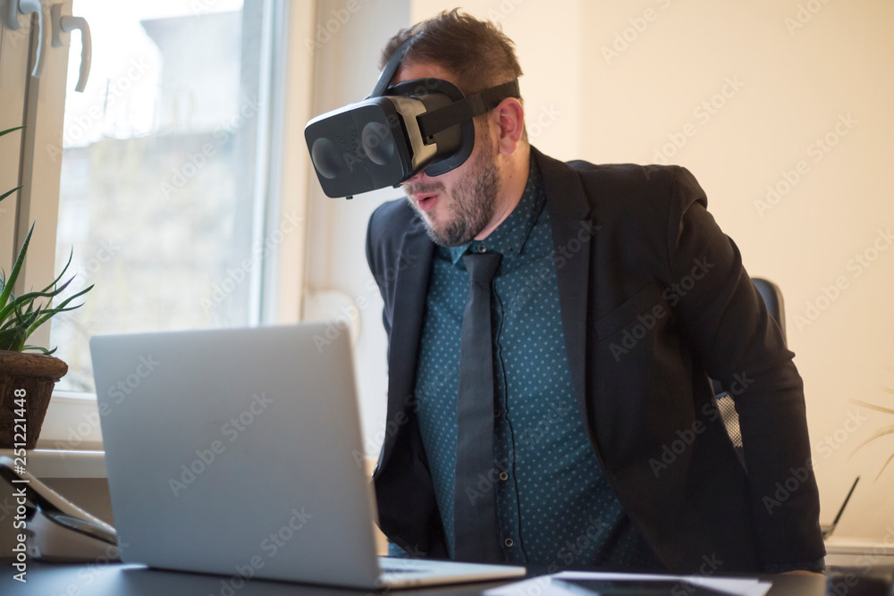 businessman finishes his work and taking virtual reality goggles on businessman finishes his work and taking virtual reality goggles on