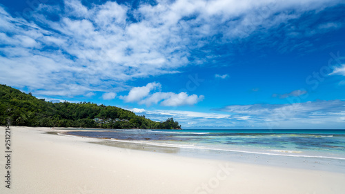 Beautiful beach. View of nice tropical beach with palms around. Holiday and vacation concept. Tropical beach.